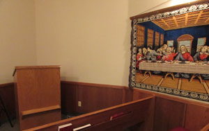 A chapel with a picture of Jesus Christ and his disciples at the last supper
